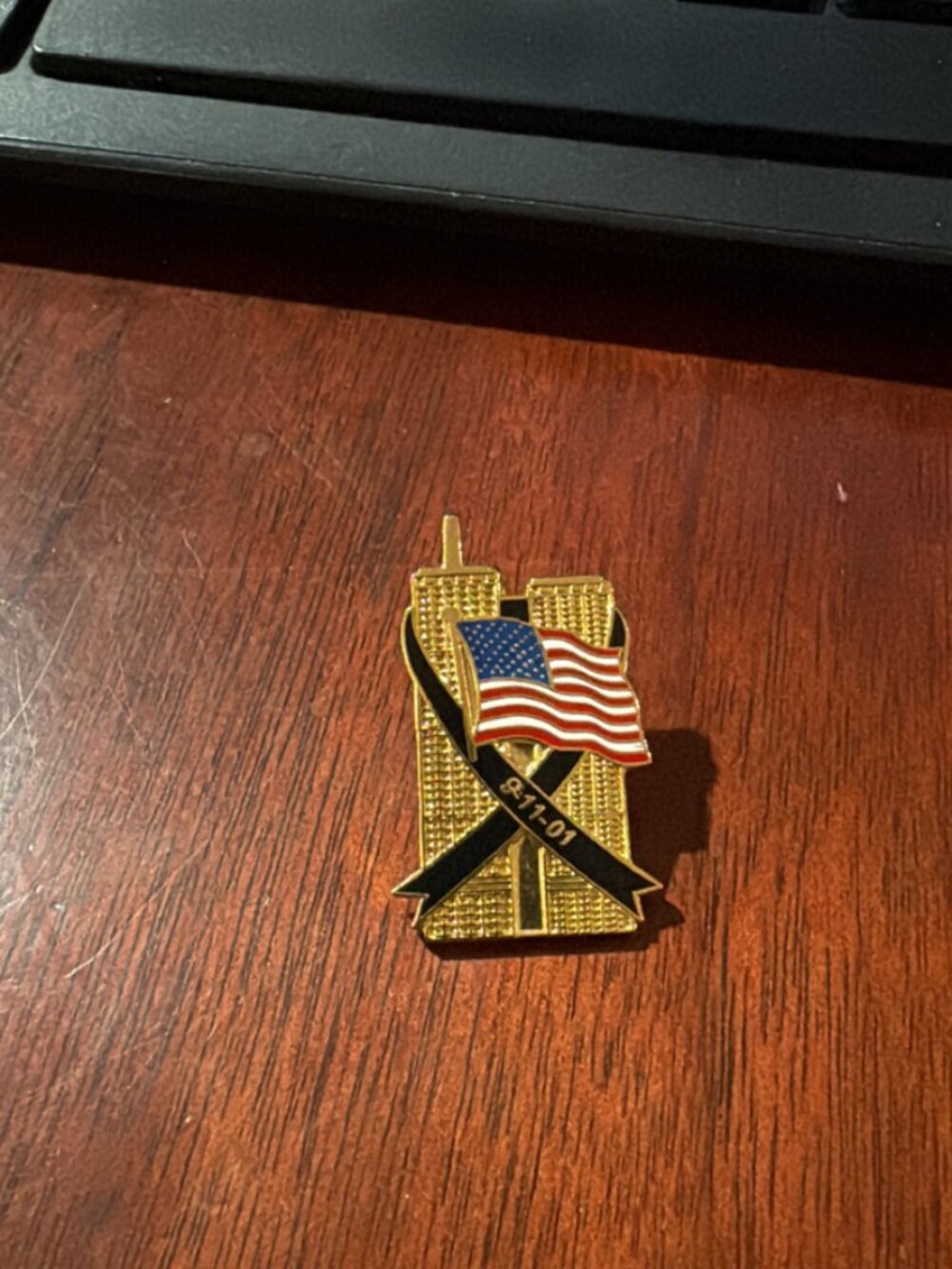 9/11 Twin Towers Memorial Pin – 9-11-01 Gold-tone enamel commemorative pin